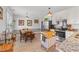 Open kitchen and dining area featuring stainless appliances, granite counters, and warm, inviting decor at 509 Par Dr, Nashville, NC 27856