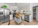 Modern kitchen featuring stainless steel appliances, white cabinetry, granite countertops, and ample storage at 509 Par Dr, Nashville, NC 27856