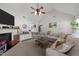 Spacious living room with a vaulted ceiling, fireplace, and a comfortable seating arrangement at 509 Par Dr, Nashville, NC 27856