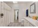Bright bathroom featuring neutral tones, wood-look flooring, and stylish macrame plant hanger for a touch of organic charm at 5320 Middleton Rd, Durham, NC 27713