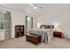 Bedroom with a ceiling fan, natural light, neutral-toned walls, and plush carpeting at 5320 Middleton Rd, Durham, NC 27713