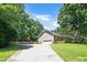 Beautiful brick and siding home featuring a spacious driveway leading to a two-car garage at 5320 Middleton Rd, Durham, NC 27713