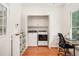 Laundry room featuring a washer and dryer, storage cabinets, and a window for natural light at 5320 Middleton Rd, Durham, NC 27713