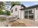 A spacious back deck features outdoor seating and sliding door access to the home's interior at 5400 Kaplan Dr, Raleigh, NC 27606