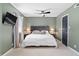 Cozy bedroom featuring a queen-sized bed with plush pillows and a ceiling fan at 5400 Kaplan Dr, Raleigh, NC 27606