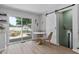 Bright dining area next to the kitchen with a sliding glass door to the backyard deck and a sliding barn door to stairs at 5400 Kaplan Dr, Raleigh, NC 27606