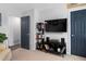 Cozy living room with entertainment center and a convenient doorway to another room at 5400 Kaplan Dr, Raleigh, NC 27606