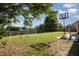 Large backyard with a soccer net and basketball hoop at 605 Bellefont Ct, Knightdale, NC 27545