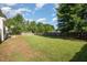 Spacious fenced backyard with a basketball hoop, soccer goal, and lush lawn at 605 Bellefont Ct, Knightdale, NC 27545