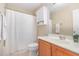 Bathroom with wood vanity, shower curtain, and plenty of storage space at 605 Bellefont Ct, Knightdale, NC 27545