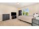 Beige bedroom featuring a TV, shelving, and neutral decor at 605 Bellefont Ct, Knightdale, NC 27545
