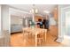 Open dining area adjacent to kitchen, featuring wood floors and natural light at 605 Bellefont Ct, Knightdale, NC 27545