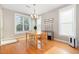 Bright dining room with hardwood floors and a classic chandelier at 605 Bellefont Ct, Knightdale, NC 27545