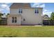 Rear exterior view of house with basketball hoop and patio at 605 Bellefont Ct, Knightdale, NC 27545