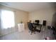 A light-filled bedroom with a modern desk and carpet flooring at 6229 Saybrooke Dr, Raleigh, NC 27604