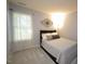 A relaxing bedroom with a queen bed, neutral walls, and large window at 6229 Saybrooke Dr, Raleigh, NC 27604