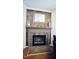 Close up of the beautiful fireplace with decorative stone surround at 6229 Saybrooke Dr, Raleigh, NC 27604