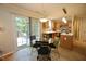 Eat-in kitchen with stainless steel appliances, pendant lighting, and access to patio at 6229 Saybrooke Dr, Raleigh, NC 27604