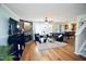 Spacious living room featuring hardwood floors, a fireplace, and plenty of natural light at 6229 Saybrooke Dr, Raleigh, NC 27604