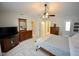 Large main bedroom featuring a king-size bed, ceiling fan, and ensuite bath access at 6229 Saybrooke Dr, Raleigh, NC 27604