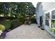 Back patio features an outdoor dining area, grill, and access to the lawn at 6229 Saybrooke Dr, Raleigh, NC 27604