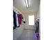 This walk-in closet has ample shelving and a window for natural light at 6229 Saybrooke Dr, Raleigh, NC 27604