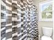 Bathroom featuring patterned shower curtain, toilet, and window at 626 Toledo Ct, Rolesville, NC 27571