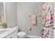 Cozy bathroom with vanity sink, toilet, and shower with decorative shower curtain at 626 Toledo Ct, Rolesville, NC 27571