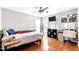 Comfortable bedroom with hardwood floors, ceiling fan, and natural light at 626 Toledo Ct, Rolesville, NC 27571