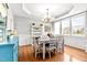 Charming dining room with chandelier, lots of light, and neutral color palette at 626 Toledo Ct, Rolesville, NC 27571