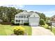 Charming two-story home with front porch, garage, and landscaped yard at 626 Toledo Ct, Rolesville, NC 27571
