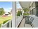 Cozy front porch with seating, offering a charming view of the neighborhood and lush landscaping at 626 Toledo Ct, Rolesville, NC 27571
