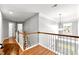 Bright hallway with wood floors and white trim at 626 Toledo Ct, Rolesville, NC 27571