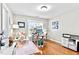 Bright home office with hardwood floors, natural light, and a cozy chair at 626 Toledo Ct, Rolesville, NC 27571