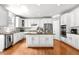 Bright, open kitchen with stainless steel appliances, granite countertops and an island at 626 Toledo Ct, Rolesville, NC 27571