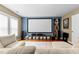 Cozy living room featuring a large movie screen and comfortable seating at 626 Toledo Ct, Rolesville, NC 27571