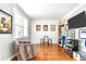 Cozy living room with hardwood floors, a window, a vintage-style decorations at 626 Toledo Ct, Rolesville, NC 27571