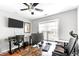 Home office with desk, computer, and large window at 626 Toledo Ct, Rolesville, NC 27571