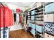 Organized walk-in closet with shelving for clothing, shoes, and accessories at 626 Toledo Ct, Rolesville, NC 27571
