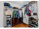 Spacious closet featuring built-in shelving, clothing racks, and wooden floors at 626 Toledo Ct, Rolesville, NC 27571