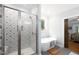 Bright bathroom featuring a tiled shower and luxurious soaking tub at 698 Maple Springs Ln, Bear Creek, NC 27207