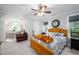 Bright bedroom with ceiling fan, ample windows and carpeted floor at 698 Maple Springs Ln, Bear Creek, NC 27207