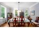 This dining room has hardwood floors, traditional furniture, large windows and a beautiful view of the outdoors at 698 Maple Springs Ln, Bear Creek, NC 27207