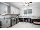 This laundry room features gray cabinets, marble countertops and a sink with stainless steel appliances at 698 Maple Springs Ln, Bear Creek, NC 27207