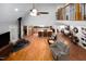 Open living space with cathedral ceilings, wood floors and open access to the second floor and kitchen at 698 Maple Springs Ln, Bear Creek, NC 27207