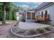 Outdoor patio features lovely landscaping and easy access to a screened porch at 698 Maple Springs Ln, Bear Creek, NC 27207