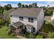Aerial view of the property showcasing the backyard, screened porch, patio, and fencing at 7 Faircroft Ct, Durham, NC 27703