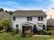 Aerial view of the home showcasing the backyard, screened porch, and patio at 7 Faircroft Ct, Durham, NC 27703
