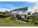 A spacious backyard features a screened-in porch and well-maintained lawn at 7 Faircroft Ct, Durham, NC 27703