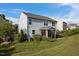 Two-story home featuring a screened-in porch, grill and a large grassy lawn at 7 Faircroft Ct, Durham, NC 27703